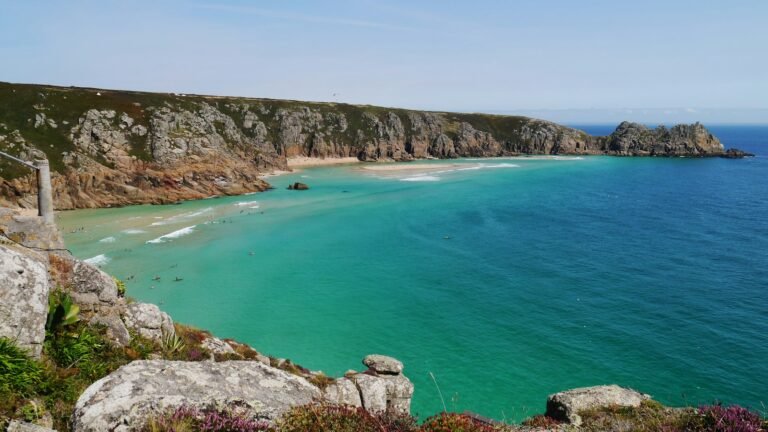 Turquoise sea below the cliffs at Porthcurno in West Penwith, near our plant hire Penzance area